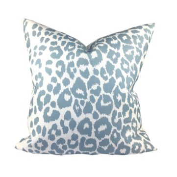 blue sky Iconic Leopard outdoor pillow against a white background