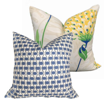 a set of 2 pillow on a white background. Blue Denver pillow and Tiverton pillow with a large yellow flower on beige