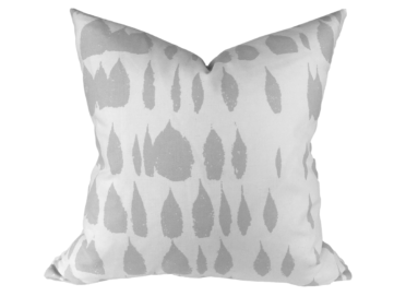 Schumacher queen of spain pillow with gray tear drops printed on a white pillow. pillow is on a white background.
